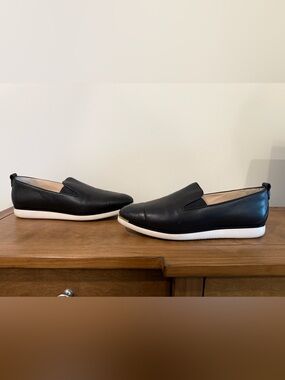 Cole Haan Women’s Black Leather Slip-On Sneakers with White Sole